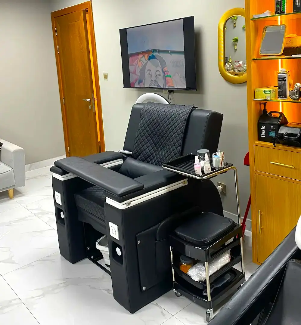 modern barber chair and interior at Kings Afro Barbershop in JVC Dubai