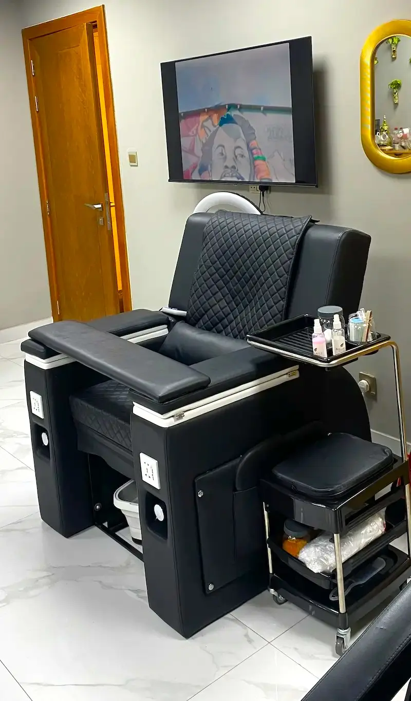 modern barber chair and interior at Kings Afro Barbershop in JVC Dubai