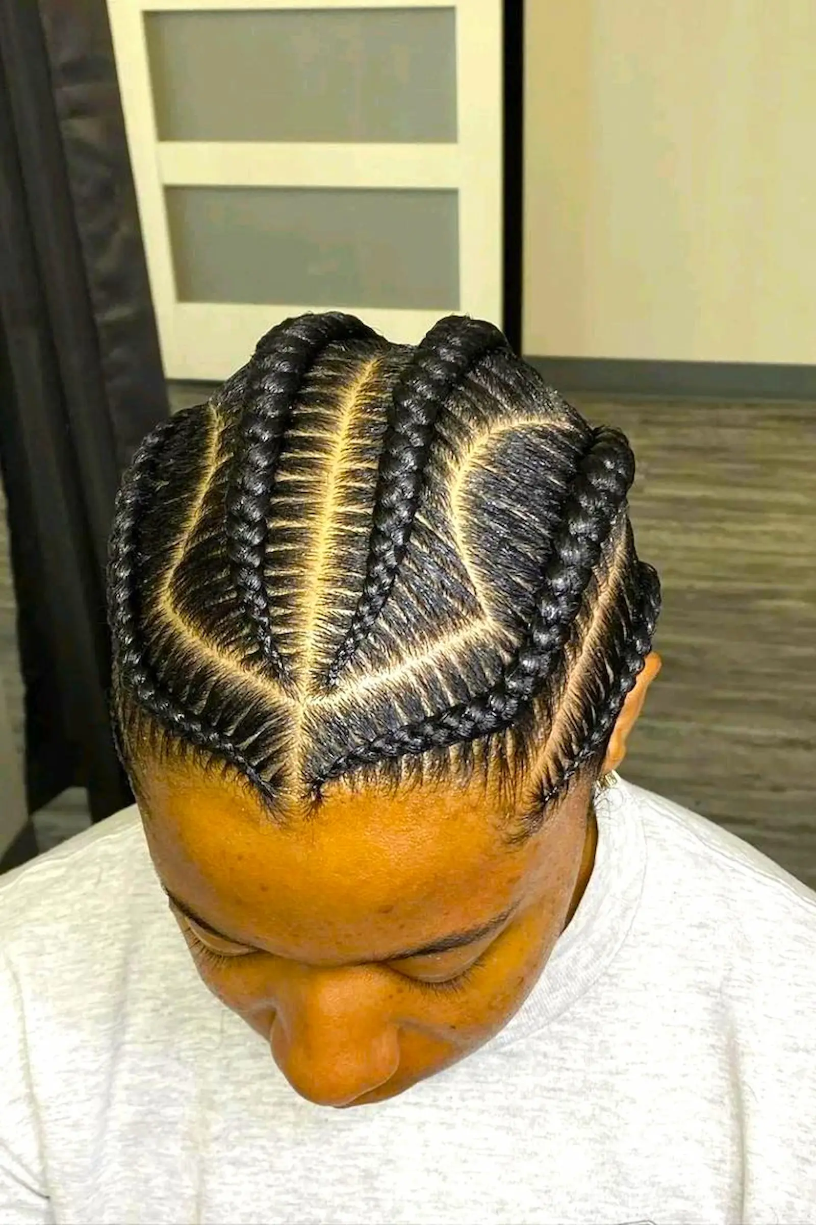 clean cornrows braids hairstyle with precise parting at Kings Afro Barbershop in JVC Dubai