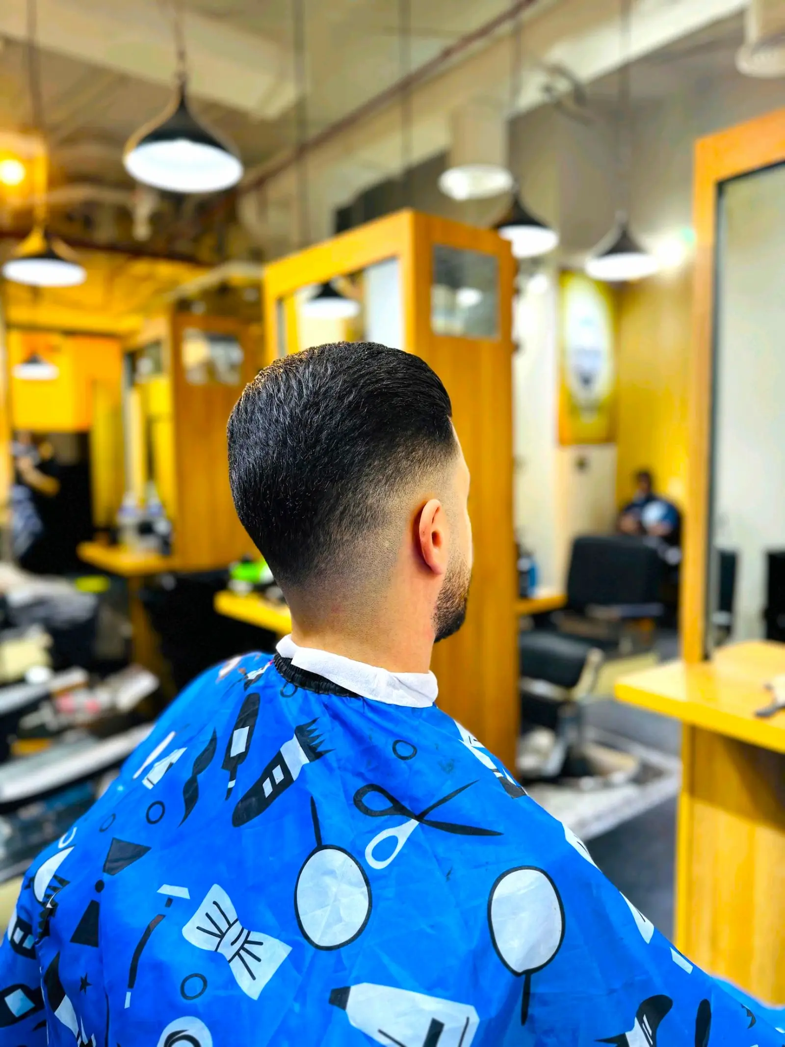 clean taper fade haircut from the back at Kings Afro Barbershop in JVC Dubai