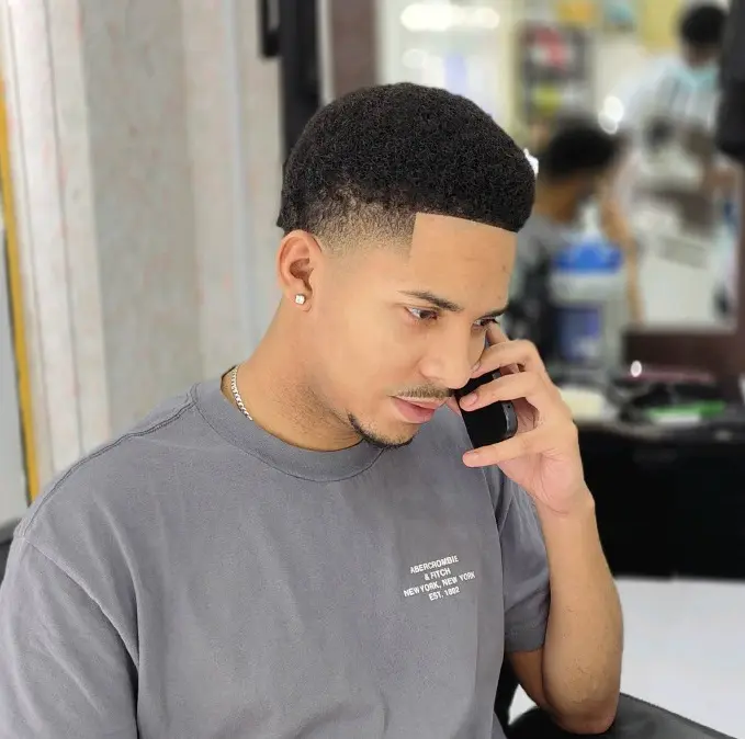 clean fade haircut with sharp lineup at Kings Afro Barbershop in JVC Dubai