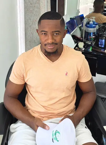 client with fresh clean fade haircut and lineup at Kings Afro Barbershop in JVC Dubai