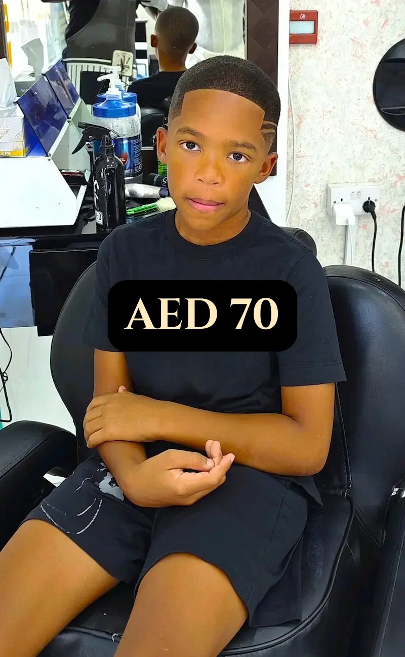 two refreshing fruit drinks with strawberries, berries and mint served in glasses with straws on a table in a barbershop