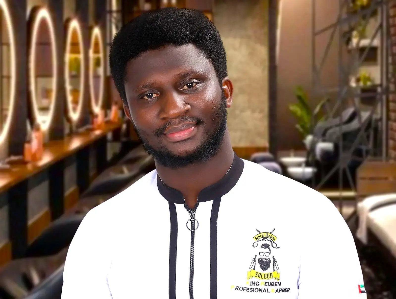 barbershop owner sitting inside a modern salon with stylish interior and warm lighting, smiling at the camera
