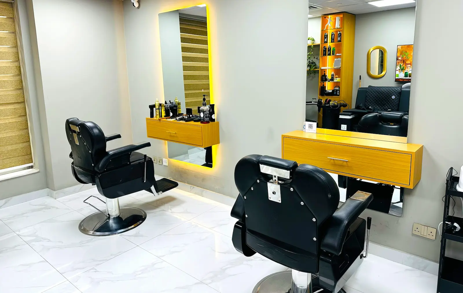 rectangular pizza with tomato sauce, ham strips and mushrooms on a cardboard tray placed