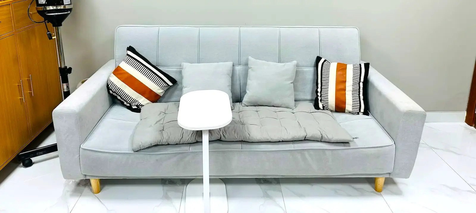 comfortable waiting area with sofa at Kings Afro Barbershop in JVC Dubai